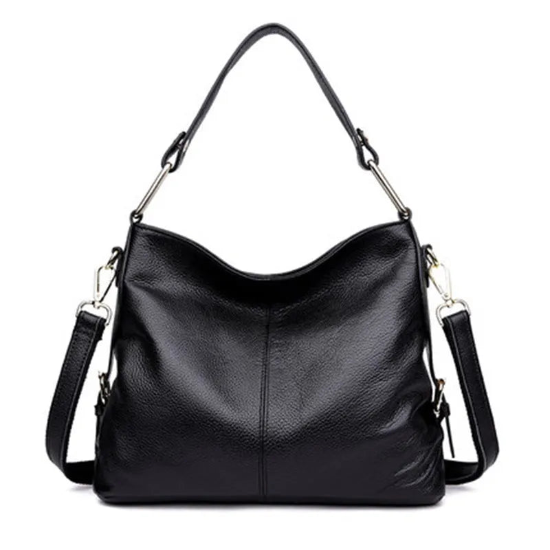 Genuine leather vertical square crossbody bag showing multiple internal pockets including a zipper changing bag and mobile phone pocket.