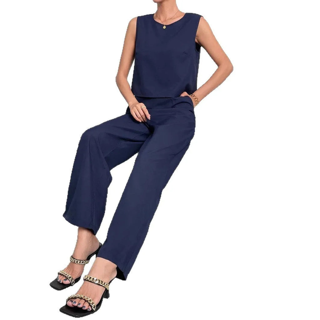 Red women's sleeveless top and wide-leg trousers two-piece set laid flat
