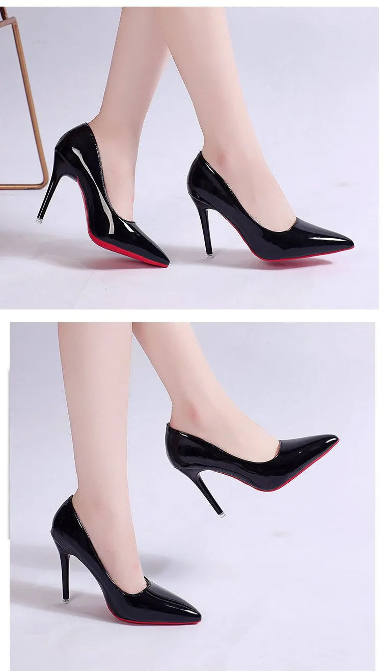 Women's black pointed toe stiletto pump with a shallow cut, shown on a white background.