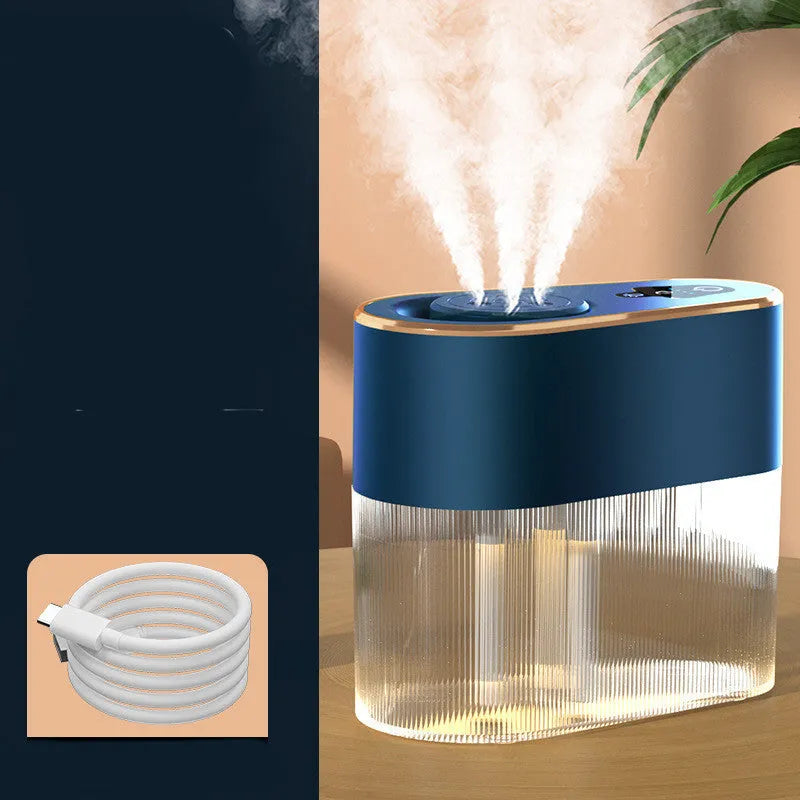 Electric three jet humidifier in blue with USB cable, 1.0-2.5L tank, and atmosphere lamp on a bedroom desktop