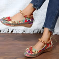 Women's black plus size ethnic platform sandals with cloth upper and elastic band.