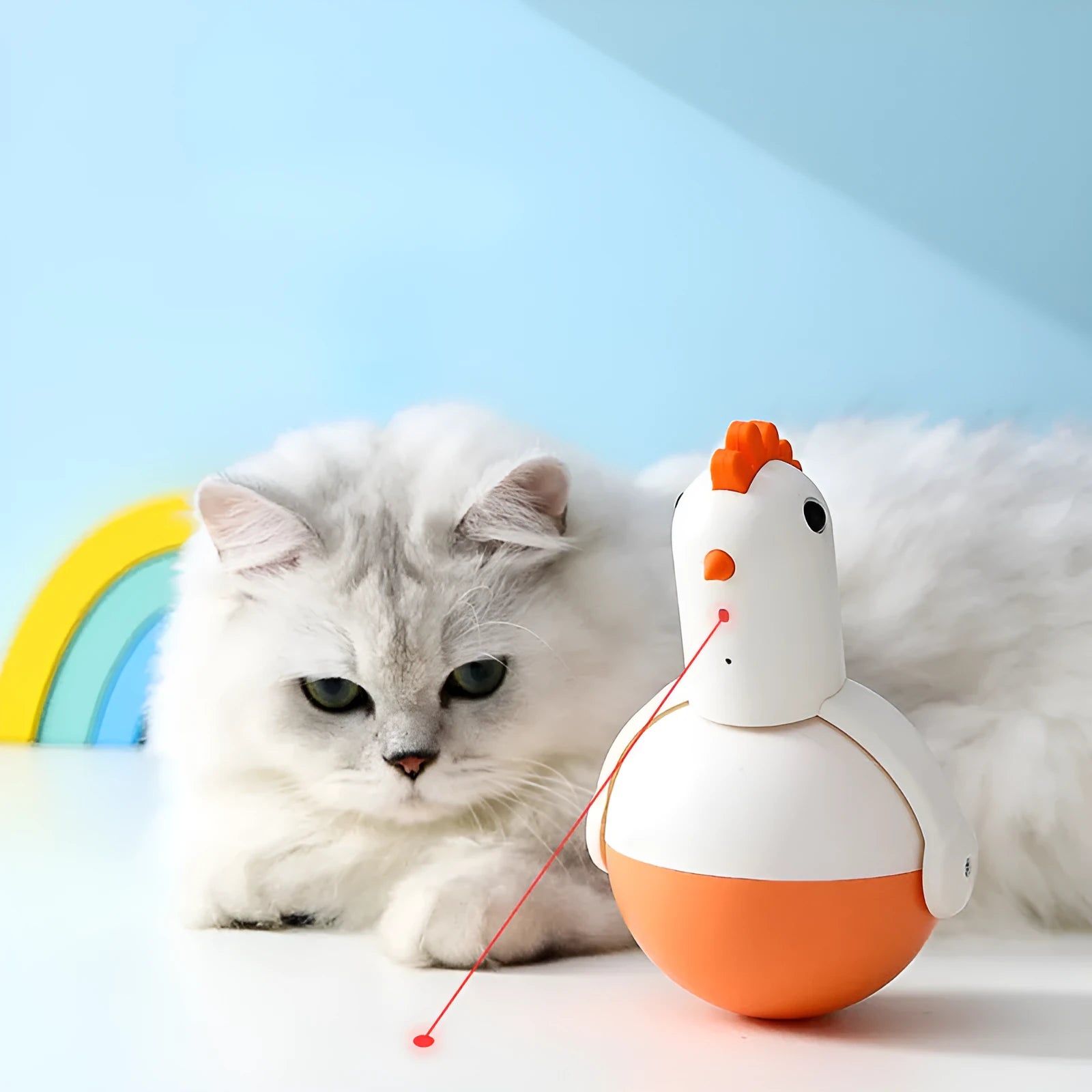 Green and orange electric cat toy with laser light feature on a wooden floor.