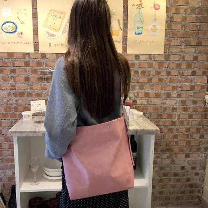 Corduroy one-shoulder commuter bag in pink or brown with PU lining, showing 39cm length dimensions