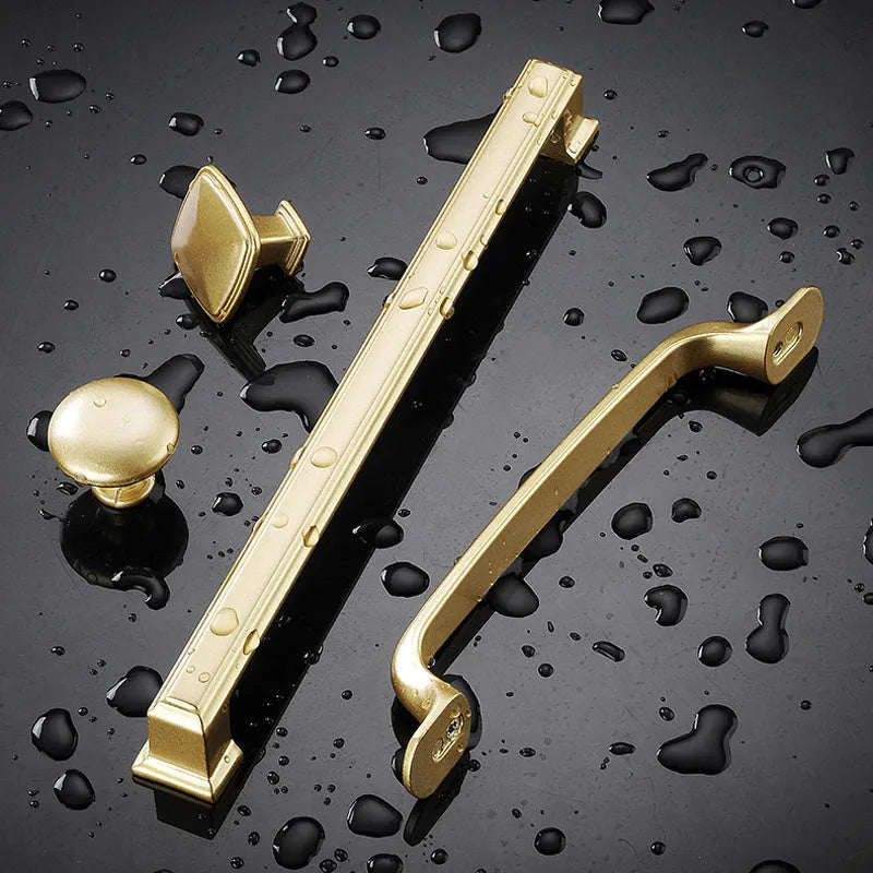 Gold aluminium alloy cabinet handle with T shape design showing single mounting hole