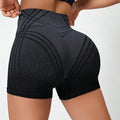 Women's high-waisted fitness shorts with gradient colour pattern in black and brown options