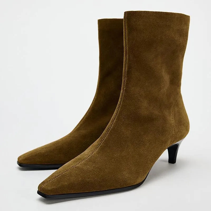Women's brown square toe ankle boots with a stiletto heel and side zipper on a white background