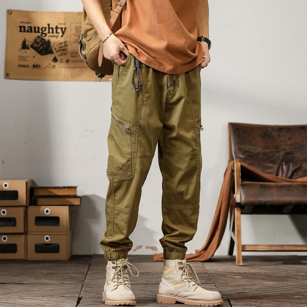 Men's cotton tapered harem pants in black colour with ankle bands and zip fly