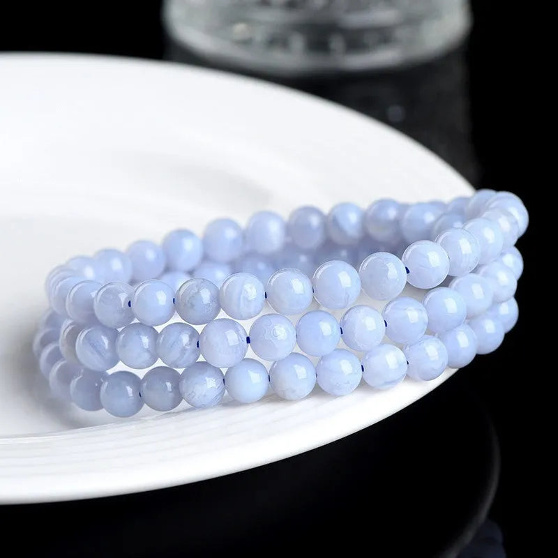 Blue striped agate bracelet with scattered beads showing multi-circle pattern