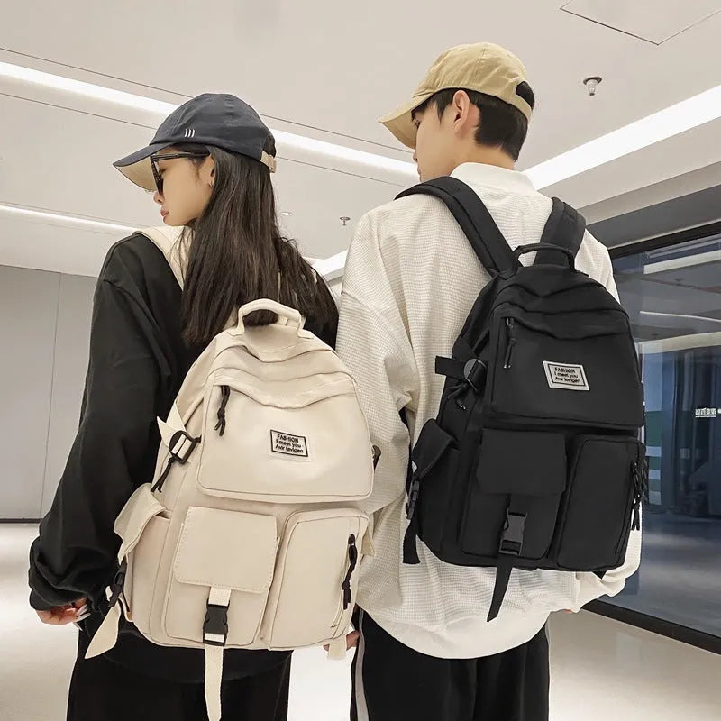 Soft nylon student backpack in black with a three-dimensional front pocket.