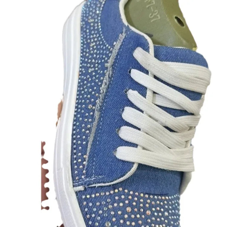 Women's black lace-up casual sports shoes with rhinestone detail on the side and a chunky rubber sole.