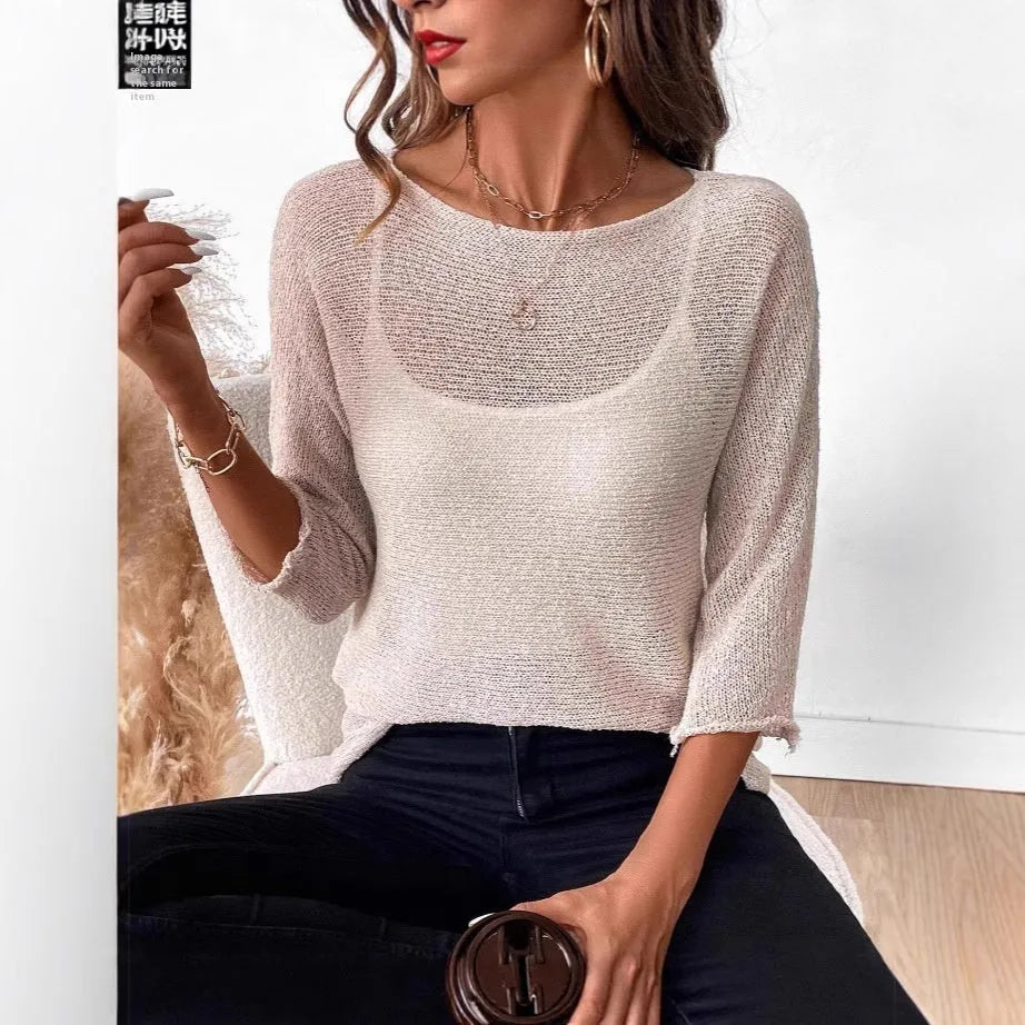 Women's knitted off-shoulder pullover top in light blue with a 3D pattern and 3/4 sleeves.