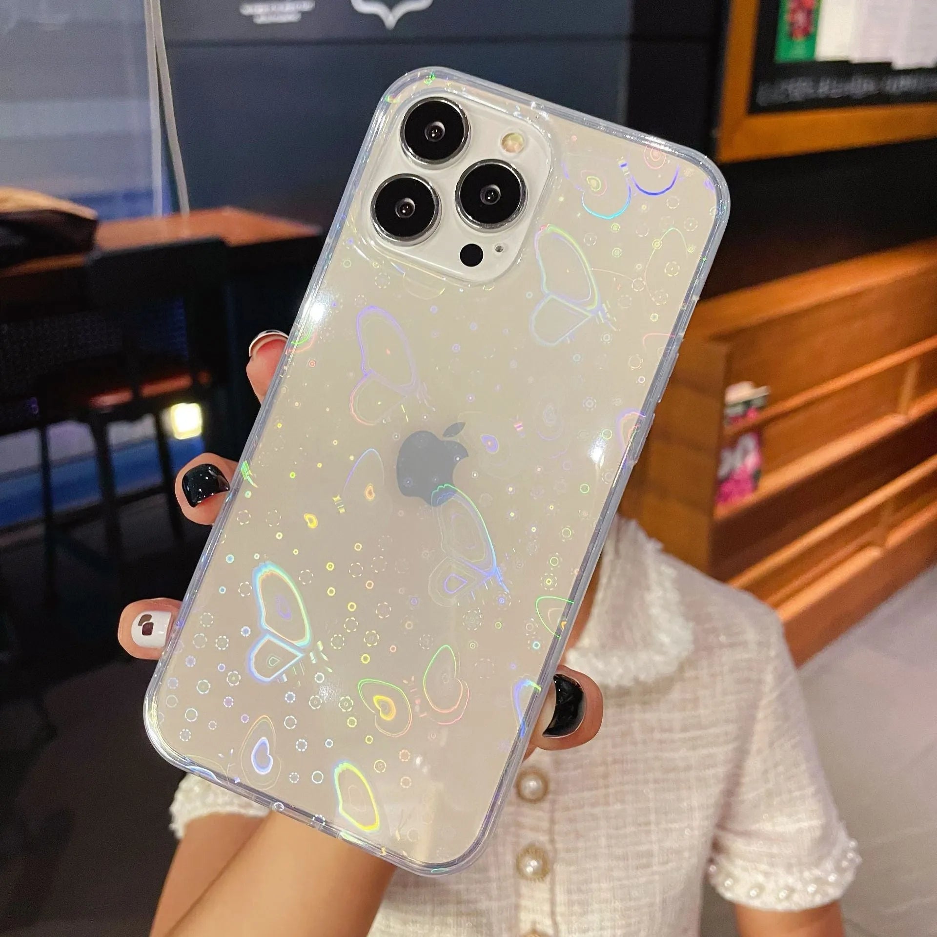 Transparent silicone iPhone case with laser love pattern design showing butterfly and clear options