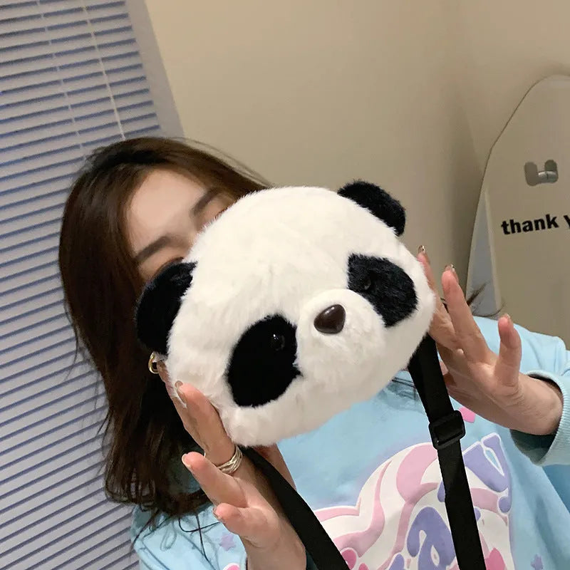 Panda head plush crossbody bag with cylindrical shape and sandwich pocket measuring 18cm
