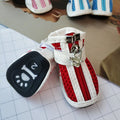 Blue, pink, and red cloth dog shoes with zippers, shown as a set of four for small breed pets.