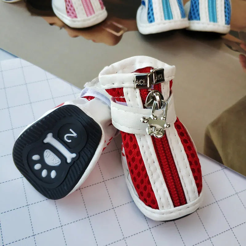 Blue, pink, and red cloth dog shoes with zippers, shown as a set of four for small breed pets.