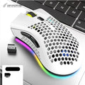 BM600 hollow-out luminous wireless gaming mouse in cyan, black, or white on a desktop.