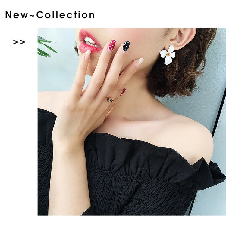 Flower-shaped alloy stud earrings with electroplated pink or white finish and clutch backings