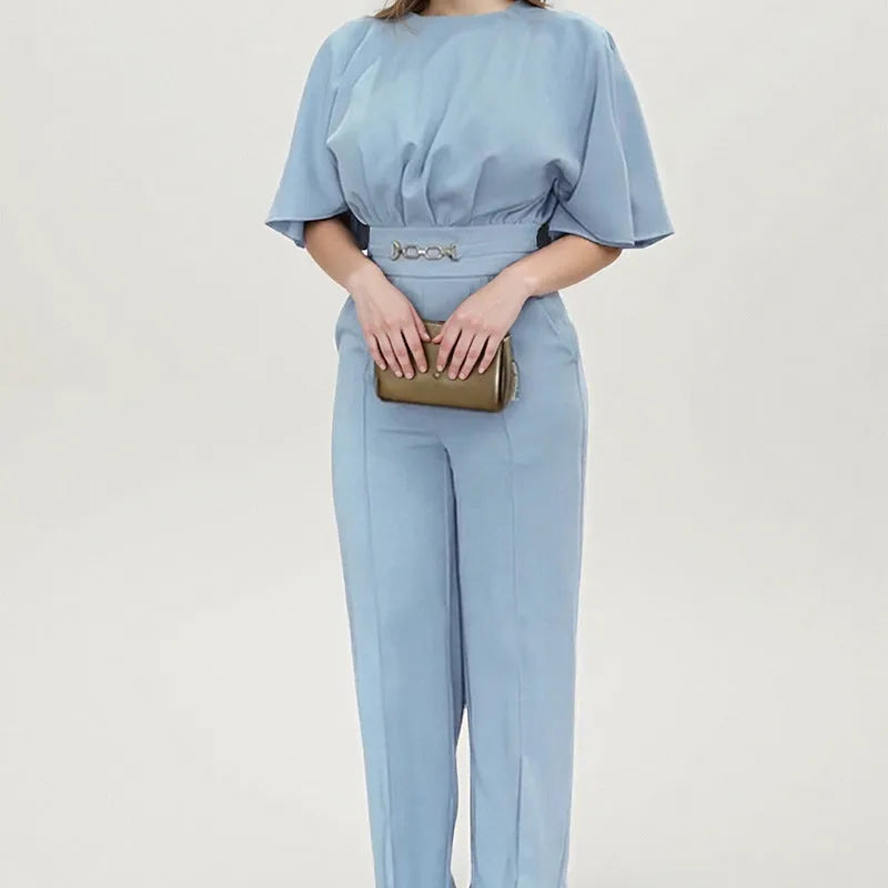 Blue men's casual polyester suit with trousers and a long-sleeve jacket on a hanger.