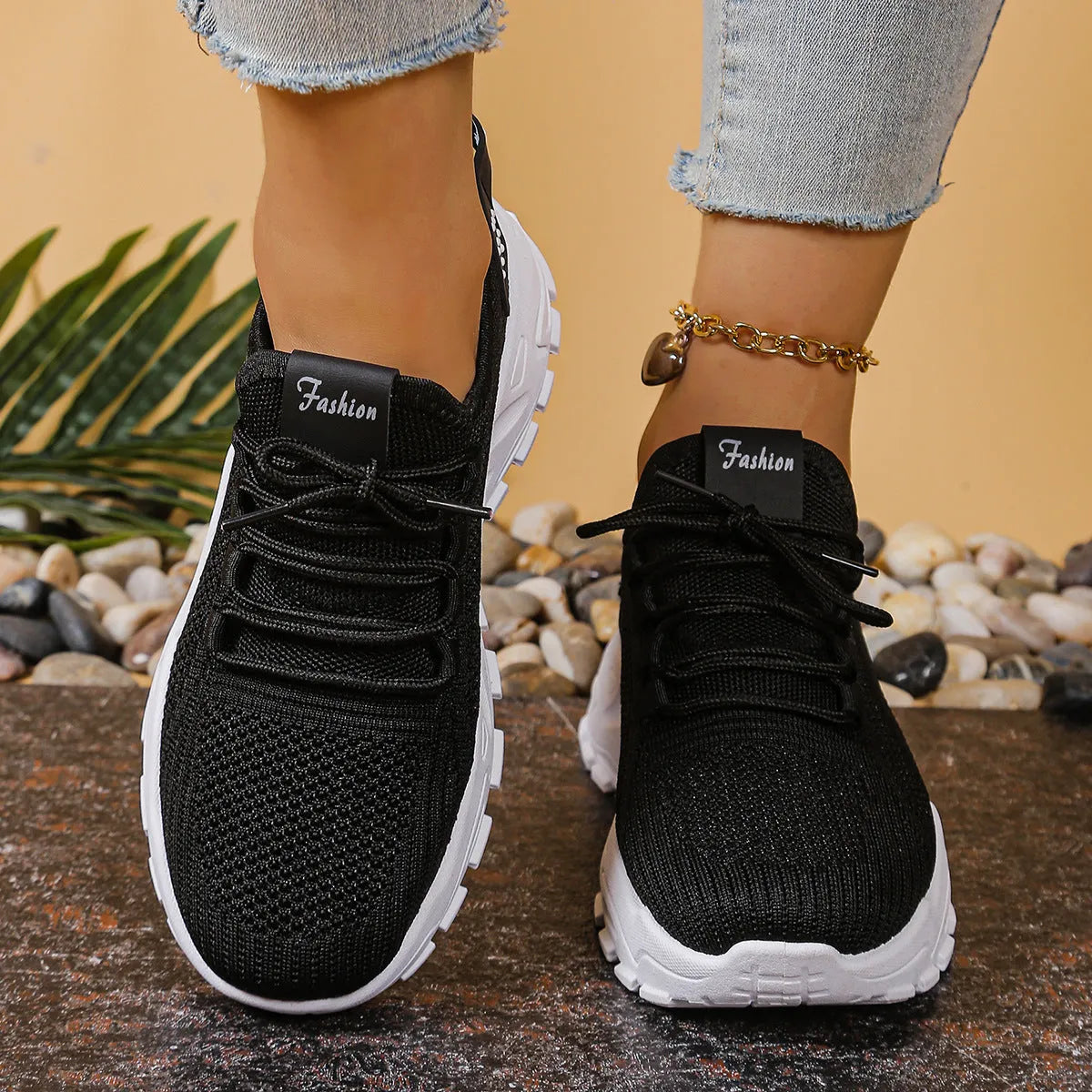 Women's low-top mesh sports trainers in multiple colours on a white background.