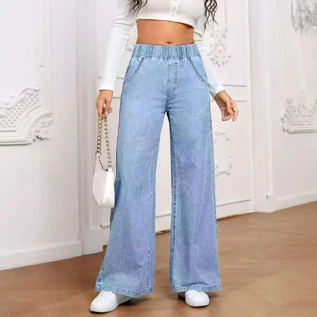 Light blue washed plus size wide-leg denim trousers laid flat showing straight leg silhouette