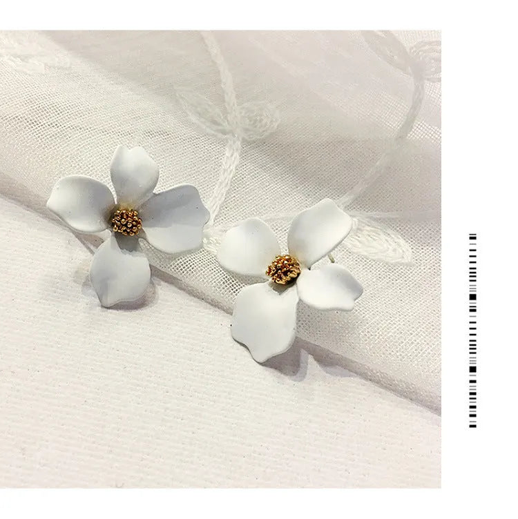 Flower-shaped alloy stud earrings with electroplated pink or white finish and clutch backings