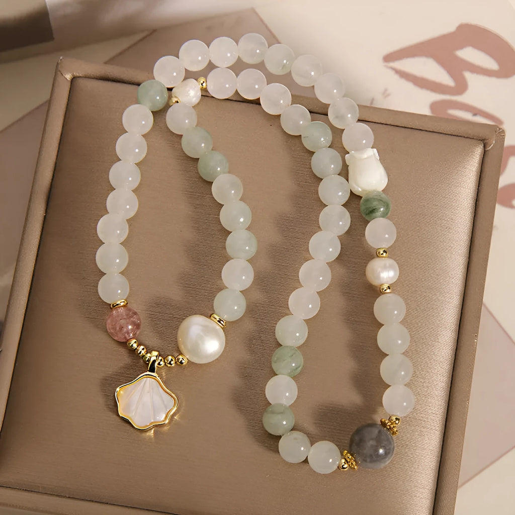 Women's crystal bracelet with gold-plated Tianshan jade shell ginkgo leaf pendant and rhinestone accents