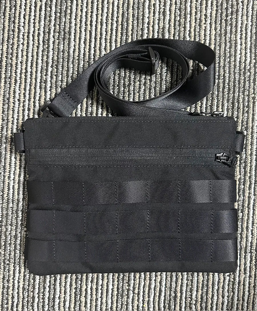 Black oxford cloth outdoor kit bag measuring 18cm by 3.5cm