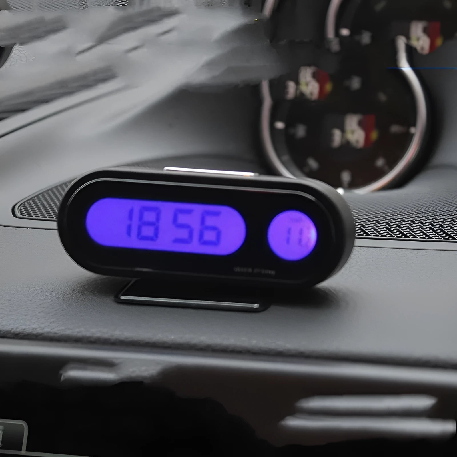 Black electronic car clock thermometer with luminous LED display showing time and temperature