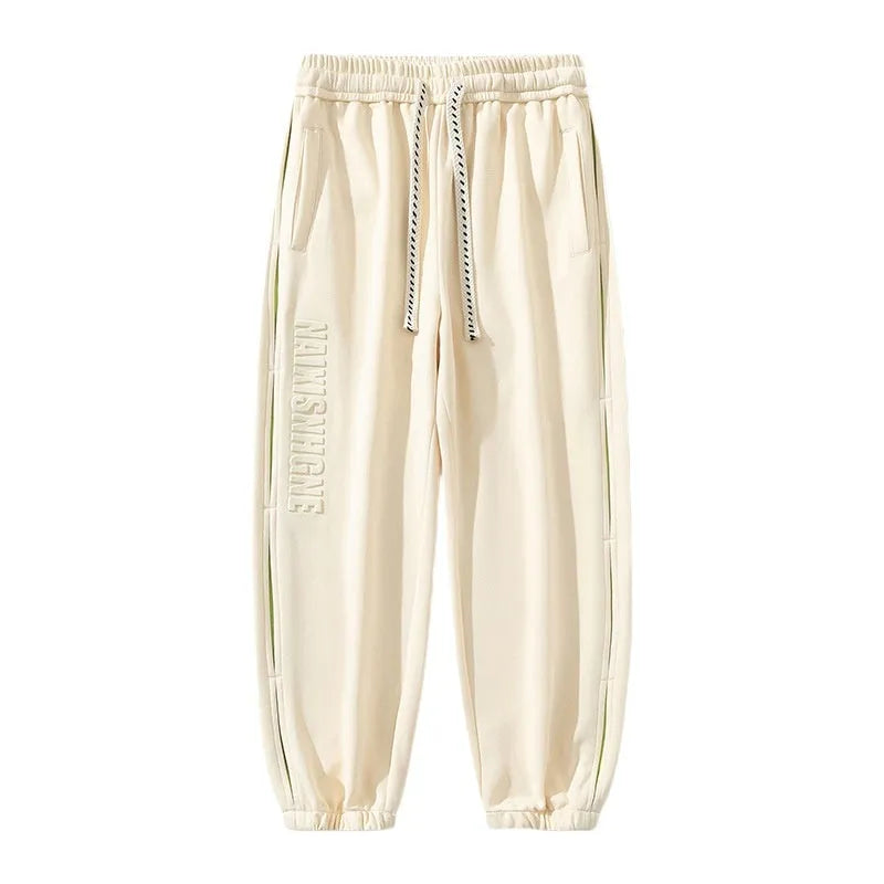 Men's cotton trousers with ankle bands and stitching detail in grey green colour