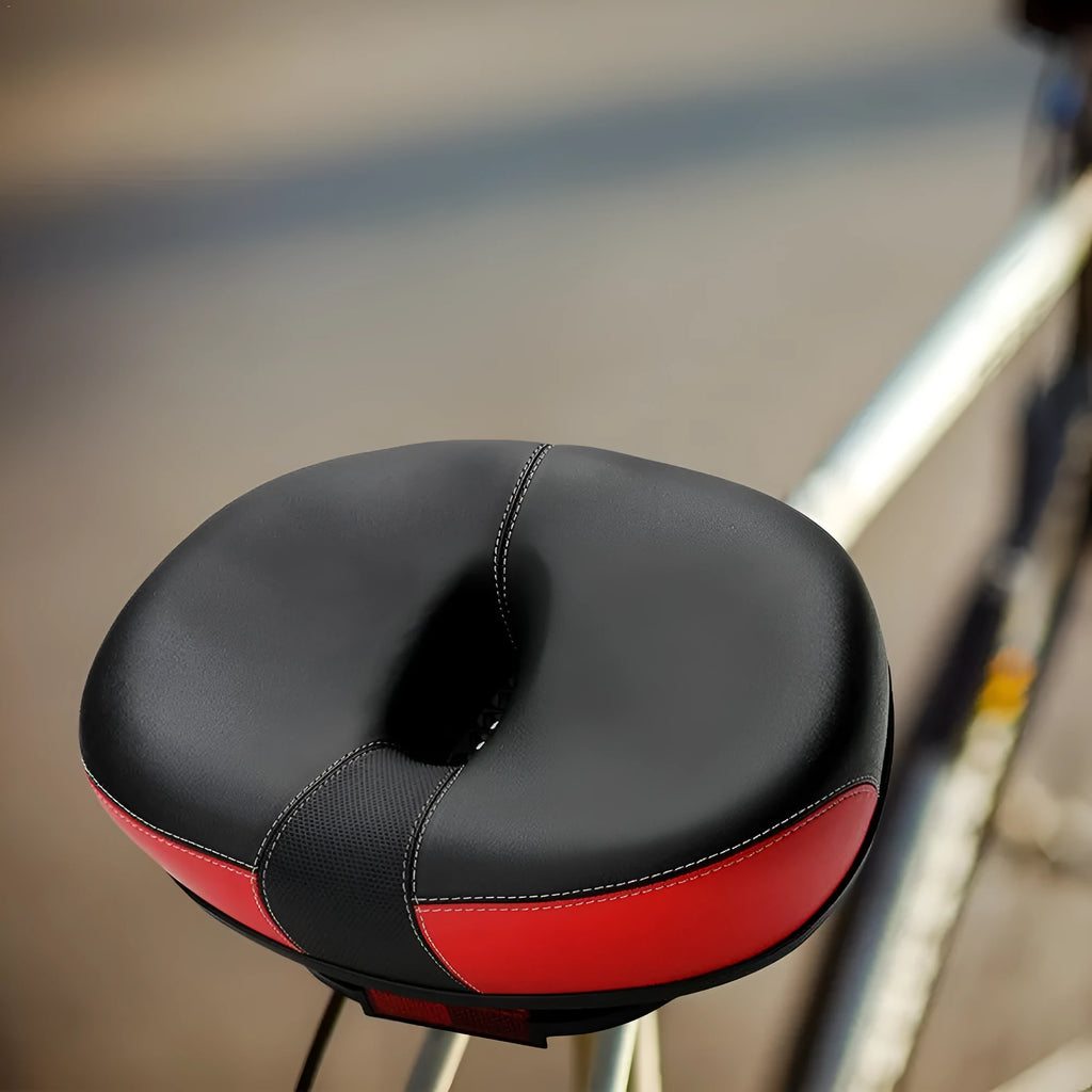 Thickened plus-size bicycle saddle in red, grey, or light brown with reflective stickers and PU cover.