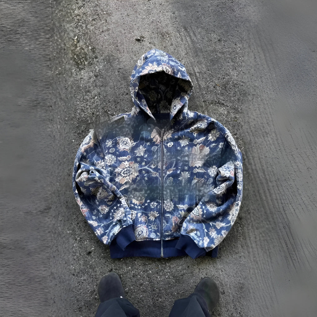 Man wearing a blue loose hooded zip-up polyester coat for casual autumn wear.