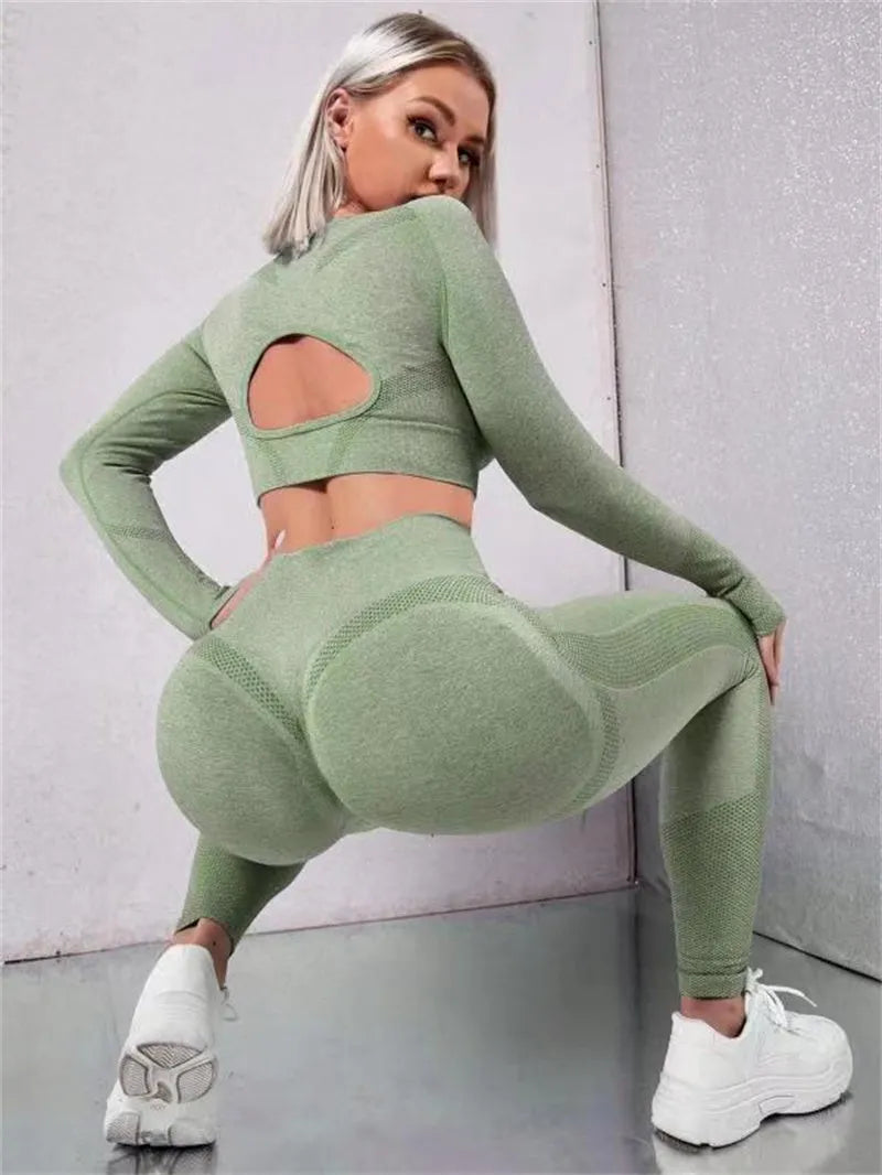 Two-piece sports suit with long sleeve hollow top and high waist seamless leggings in green