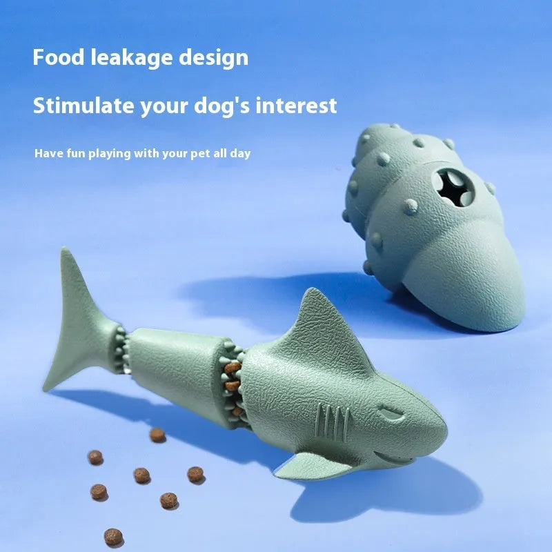 Blue and green rubber dog chew toy shaped like a deep sea shark, conch, and starfish.