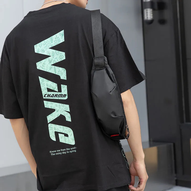 Black Oxford cloth crossbody waist pack showing multiple internal pockets and zipper closure