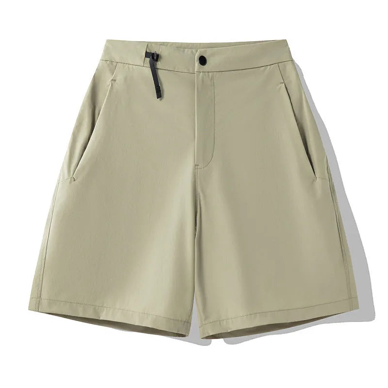 Men's quick-drying sports shorts in khaki colour with elastic waistband.