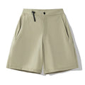 Men's quick-drying sports shorts in khaki colour with elastic waistband.