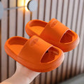 Children's bright coloured EVA slippers with textured non-slip soles on a white background.