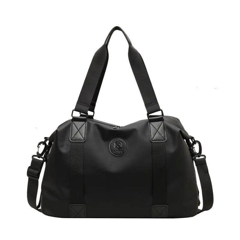 Oxford cloth travel bag in black with 36-55 litre capacity showing breathable back panel and organisational compartments