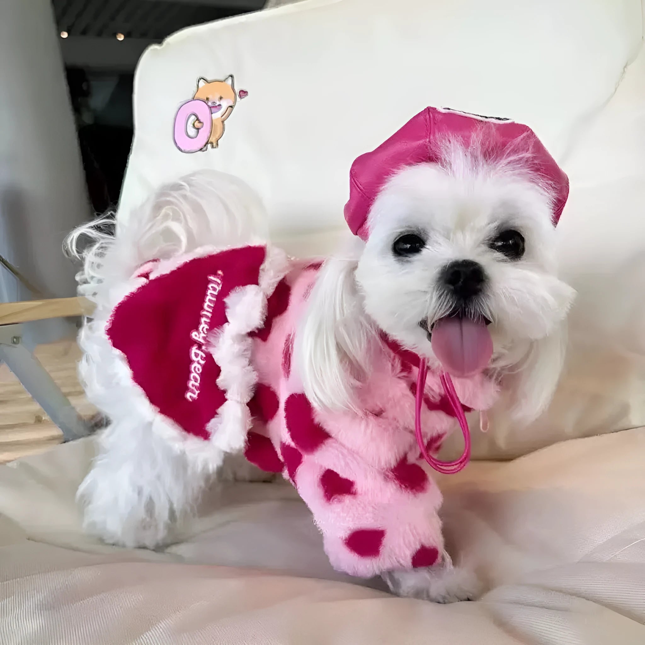 Polyester plush warm coat for small dog breeds in pink and brown colour options showing British-style design