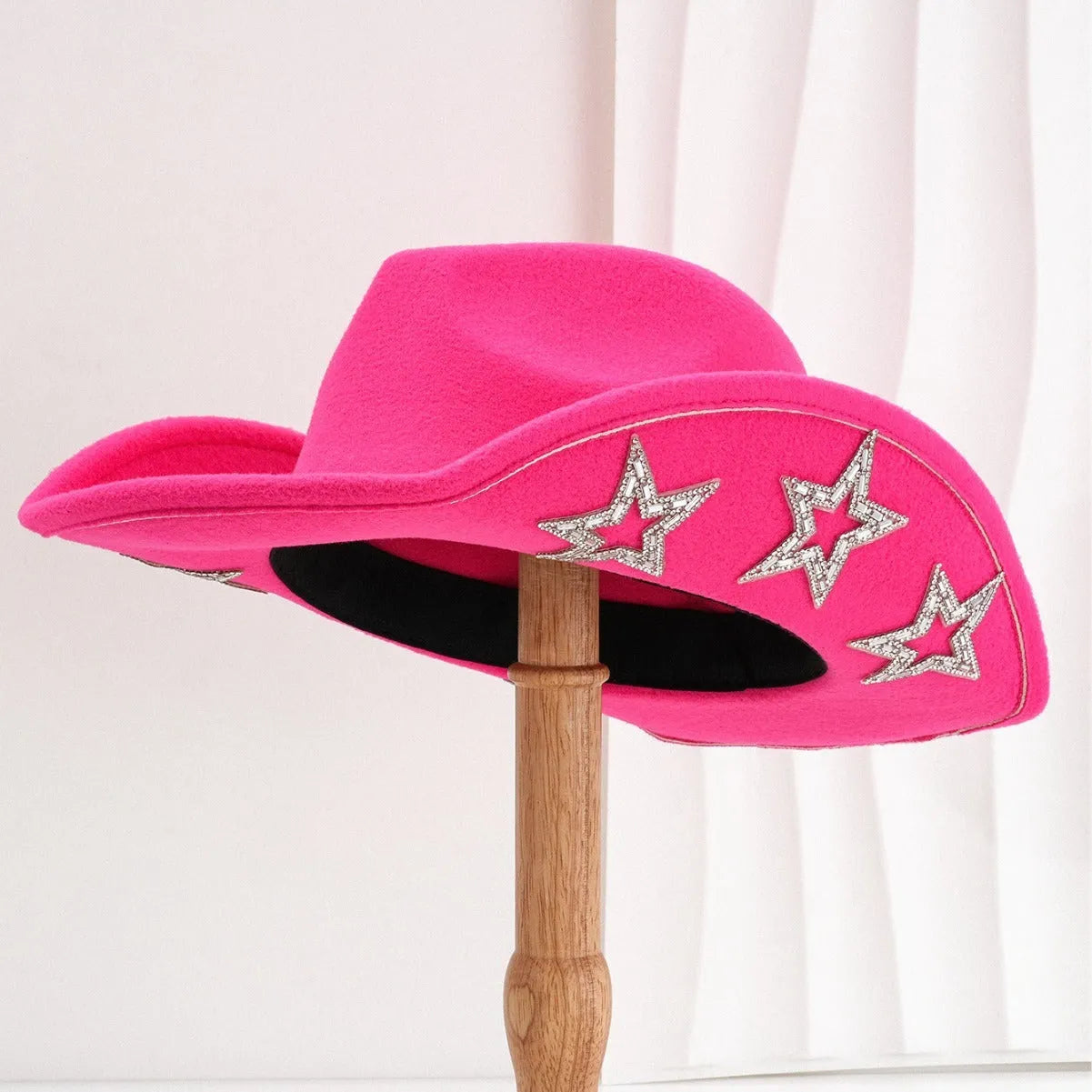 Denim top hat made from woolen felt with a conical crown and hexagonal star decoration.