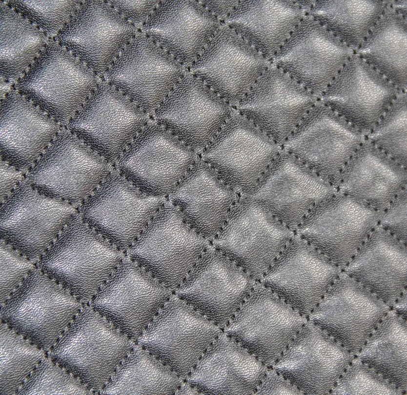 Black quilted automotive seat cover with plastic hook fasteners