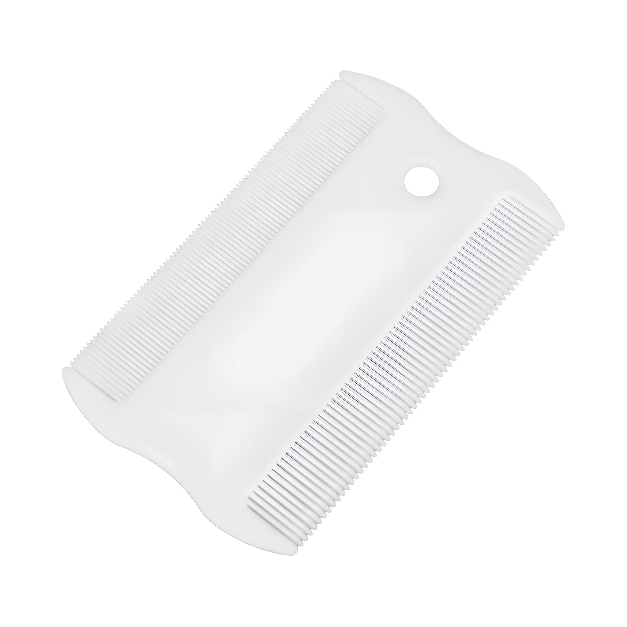 A small white plastic double-sided flea comb for pets, shown next to a ruler for scale.