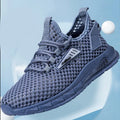 Men's beige mesh sneakers with synthetic leather upper and lace-up front on a white background