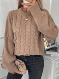 A woman's loose-fit round neck sweater in a solid colour, shown in a casual street fashion style.