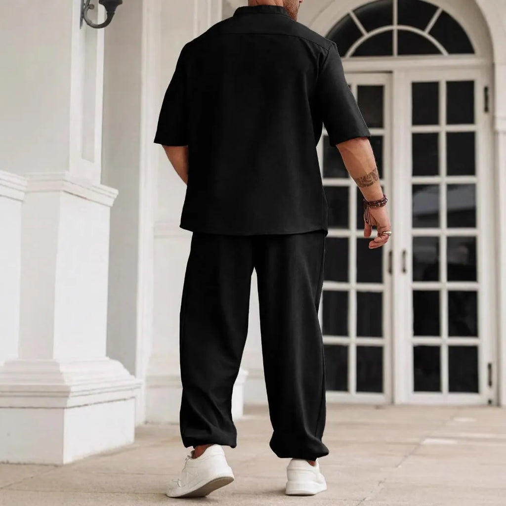 Men's apricot coloured cotton linen casual short-sleeved shirt and trouser set laid flat.