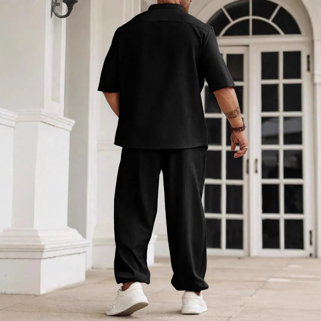Men's apricot coloured cotton linen casual short-sleeved shirt and trouser set laid flat.