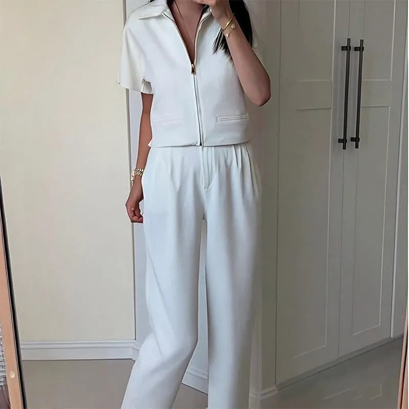 Woman wearing a loose-fitting white damascus-pattern short sleeve polyester casual shirt.