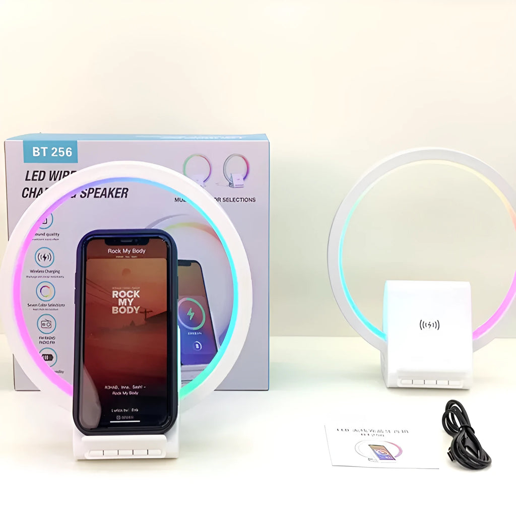 White smart Bluetooth speaker with integrated ambient light and 15W wireless charging pad on top.