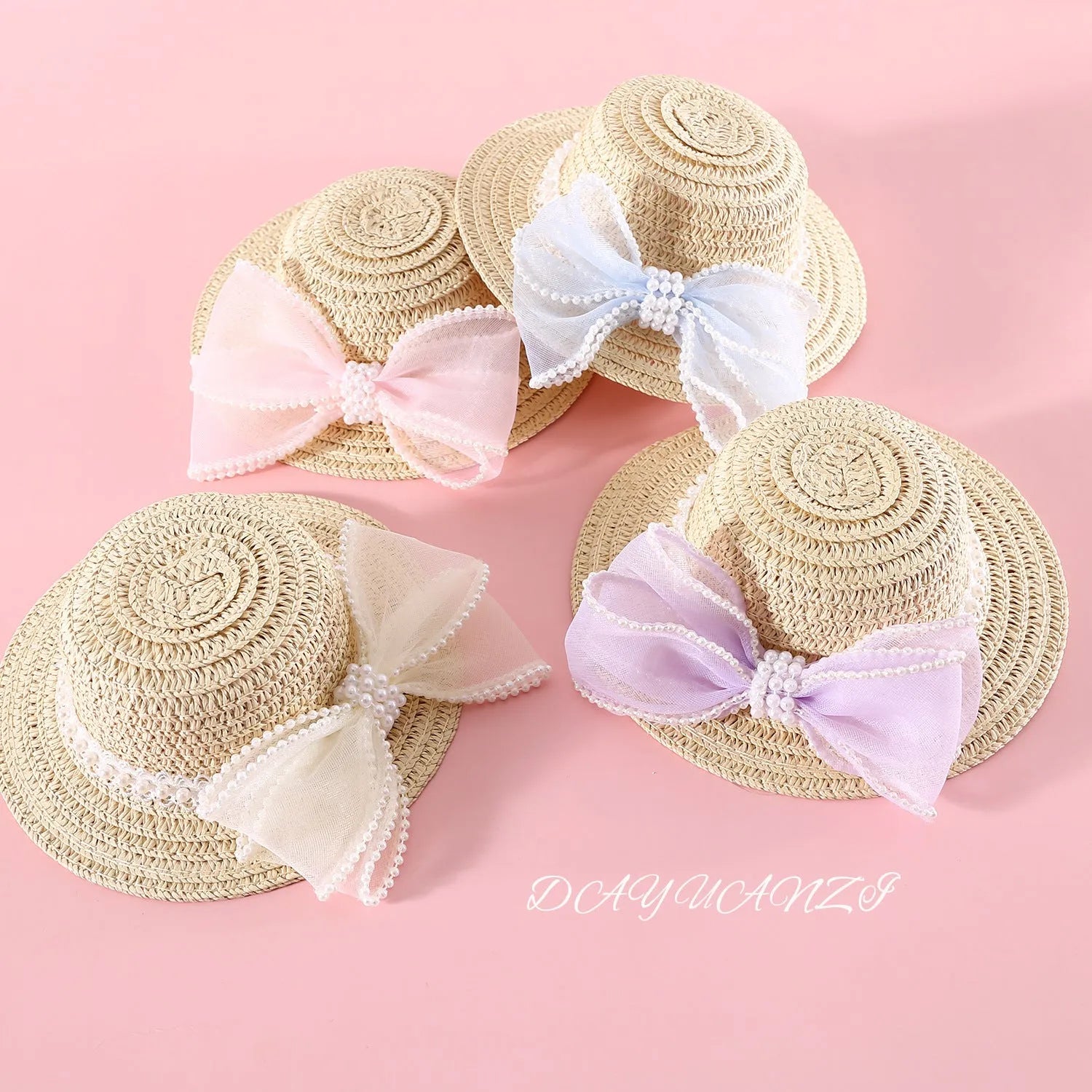 Pet cat wearing woven straw hat with pearl bow decoration in seasonal colour option