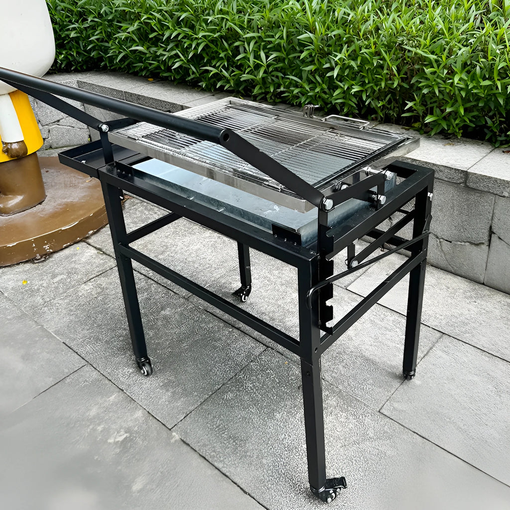 Foldable large charcoal barbecue grill shown in a garden setting